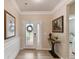 Bright foyer features hardwood floors, a decorative door, and elegant decor at 3333 Oliver Stanley Trl, Lancaster, SC 29720