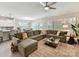 Open-concept living room featuring a comfortable sectional sofa and connection to the dining area at 3333 Oliver Stanley Trl, Lancaster, SC 29720