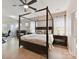 Main bedroom features a four poster bed, ceiling fan, and neutral decor at 3333 Oliver Stanley Trl, Lancaster, SC 29720