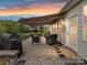 Inviting brick patio area with awning, wicker furniture, and outdoor grill, perfect for relaxing and entertaining outdoors at 3333 Oliver Stanley Trl, Lancaster, SC 29720