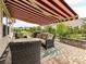 Outdoor patio with comfortable seating, a stylish awning, and a well-maintained backyard at 3333 Oliver Stanley Trl, Lancaster, SC 29720