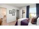 Cozy bedroom with natural light, featuring soft carpet, and framed art with sports theme and walk-in closet at 414 Janie Nw Cir, Newton, NC 28658
