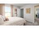 Relaxing bedroom with window view, featuring a closet and doorway at 414 Janie Nw Cir, Newton, NC 28658