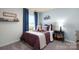 Charming bedroom with sports theme, including a football wall decoration and matching decorative pillows at 414 Janie Nw Cir, Newton, NC 28658