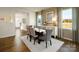 Inviting dining room with windows, modern sideboard and dining table at 414 Janie Nw Cir, Newton, NC 28658
