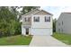 Charming two-story home features a well-manicured lawn and attached two car garage at 414 Janie Nw Cir, Newton, NC 28658
