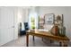 Well-lit home office with desk, shelves, comfortable chair, and view to the outside at 414 Janie Nw Cir, Newton, NC 28658