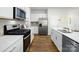 The kitchen has stainless steel appliances, white cabinets and a kitchen island at 414 Janie Nw Cir, Newton, NC 28658