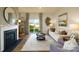 Cozy living room with fireplace and sliding glass doors to the backyard at 414 Janie Nw Cir, Newton, NC 28658