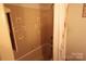 Simple bathroom showcasing the bathtub, shower, and tile, offering a clean and functional space at 425 Roselawn Pl, Charlotte, NC 28211