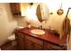 Stylish bathroom vanity with unique sink, granite countertop, and wood cabinets, adding a touch of elegance at 425 Roselawn Pl, Charlotte, NC 28211