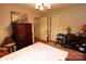 Cozy bedroom featuring hardwood floors, a dresser, natural lighting, and closet space at 425 Roselawn Pl, Charlotte, NC 28211