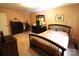 Cozy bedroom features a bed, dresser, and warm color palette, creating a comfortable and inviting space at 425 Roselawn Pl, Charlotte, NC 28211
