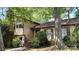 Charming two-story home featuring a brick facade and lush landscaping at 425 Roselawn Pl, Charlotte, NC 28211