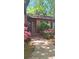 Inviting front porch with vibrant flowers and brick steps at 425 Roselawn Pl, Charlotte, NC 28211