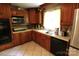 Functional kitchen with wooden cabinets and modern appliances at 425 Roselawn Pl, Charlotte, NC 28211