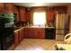 Well-lit kitchen with stainless steel appliances and lots of cabinet space at 425 Roselawn Pl, Charlotte, NC 28211