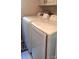 Updated laundry machines featured in a bright and clean laundry room, tiled floors, and easy backyard access at 425 Roselawn Pl, Charlotte, NC 28211