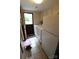 Bright laundry area with updated appliances, tile flooring, and access to the backyard at 425 Roselawn Pl, Charlotte, NC 28211