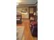 Inviting living room with a classic design, hardwood floors, and a vintage automotive art piece at 425 Roselawn Pl, Charlotte, NC 28211