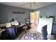 Functional home office features a ceiling fan, desk, and filing cabinets, providing ample space for productivity at 425 Roselawn Pl, Charlotte, NC 28211