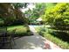 A serene backyard pool and patio offer a refreshing escape with lush landscaping at 425 Roselawn Pl, Charlotte, NC 28211