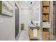 Modern bathroom featuring floating vanity, sleek mirror, and stylish storage solutions at 444 Starnes Circle Dr, Taylorsville, NC 28681