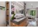 The bathroom features double vanity, wooden cabinet, concrete countertop, shelving with decor, and an open doorway to the bedroom at 444 Starnes Circle Dr, Taylorsville, NC 28681