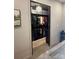Walk-in closet with black metal shelving and carpet flooring featuring hanging clothes and overhead storage at 444 Starnes Circle Dr, Taylorsville, NC 28681