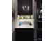 Modern dry bar with dark cabinetry, open shelving, and decorative countertop at 444 Starnes Circle Dr, Taylorsville, NC 28681