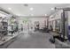 Spacious home gym featuring rubber flooring, multiple workout machines and a wall of mirrors at 444 Starnes Circle Dr, Taylorsville, NC 28681