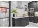 Modern kitchen featuring sleek cabinetry, stainless steel appliances, and a center island with cooktop at 444 Starnes Circle Dr, Taylorsville, NC 28681