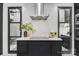 Stylish kitchen with a modern cooktop island, stainless steel range hood, and contemporary design elements at 444 Starnes Circle Dr, Taylorsville, NC 28681