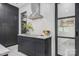 Sleek kitchen showcasing a modern island with a cooktop, range hood, and minimalist design at 444 Starnes Circle Dr, Taylorsville, NC 28681