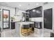 Modern kitchen featuring a waterfall island with bar seating, sleek cabinetry, and stainless steel appliances at 444 Starnes Circle Dr, Taylorsville, NC 28681