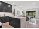 Open-concept kitchen flows into the living area, featuring a marble island and modern finishes throughout at 444 Starnes Circle Dr, Taylorsville, NC 28681