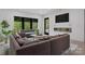 Inviting living room featuring comfortable seating, a fireplace, and scenic outdoor views at 444 Starnes Circle Dr, Taylorsville, NC 28681