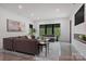 Bright and airy living room with large windows, modern decor, and a cozy seating area at 444 Starnes Circle Dr, Taylorsville, NC 28681