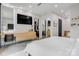 Open main bedroom featuring wood vanity, large tv and ample natural light at 444 Starnes Circle Dr, Taylorsville, NC 28681