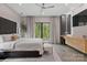 Stylish main bedroom with views, comfortable seating, and modern lighting at 444 Starnes Circle Dr, Taylorsville, NC 28681