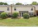 Townhome backyard, featuring green grass and patio space at 4609 Coronado Dr, Charlotte, NC 28212
