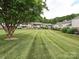 Well-maintained lawn with mature trees at 4609 Coronado Dr, Charlotte, NC 28212
