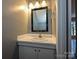 Bathroom featuring white vanity, mirror, and classic fixtures at 4609 Coronado Dr, Charlotte, NC 28212