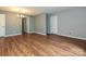 Spacious living room with laminate flooring and neutral walls at 4609 Coronado Dr, Charlotte, NC 28212