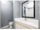 Bright bathroom showcasing a vanity, toilet, and shower at 4609 Coronado Dr # N, Charlotte, NC 28212