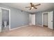 Neutral-toned bedroom offers an en-suite bathroom and spacious closet at 4609 Coronado Dr # N, Charlotte, NC 28212