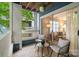 Relaxing condo balcony with seating overlooking tree-lined street and bright interior view at 611 Olmsted Park Pl # C, Charlotte, NC 28203