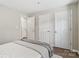 Neutral colored bedroom view showing multiple closets with modern doors and an open doorway at 611 Olmsted Park Pl # C, Charlotte, NC 28203