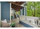 Exterior porch with wicker furniture and greenery at 611 Olmsted Park Pl # C, Charlotte, NC 28203