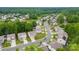 Serene aerial view of homes surrounded by lush green trees and a tranquil pond at 614 Oldham Ln, Rock Hill, SC 29732